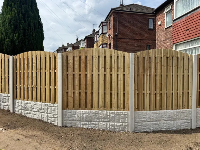 Arched Panel Fence with Concrete Posts & Gravel Boards by Sheffield Fencing
