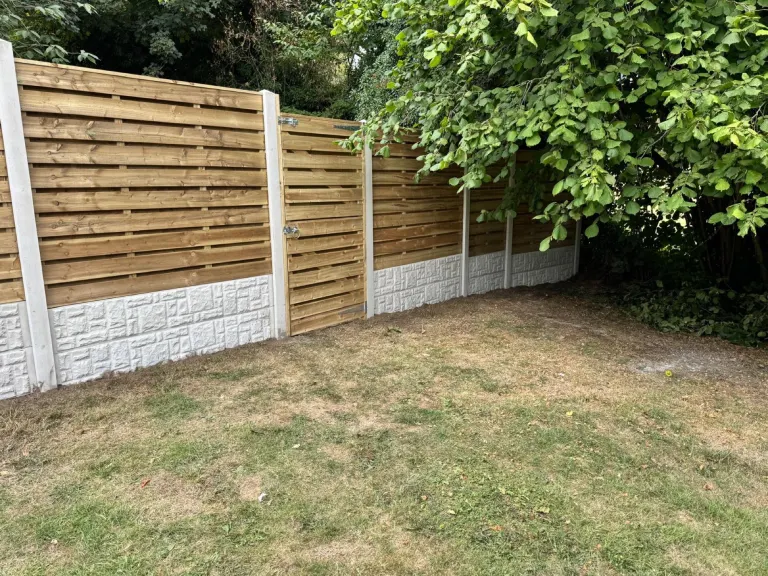 Horizontal Slatted Fencing for a Large Sloping Garden by Sheffield Fencing