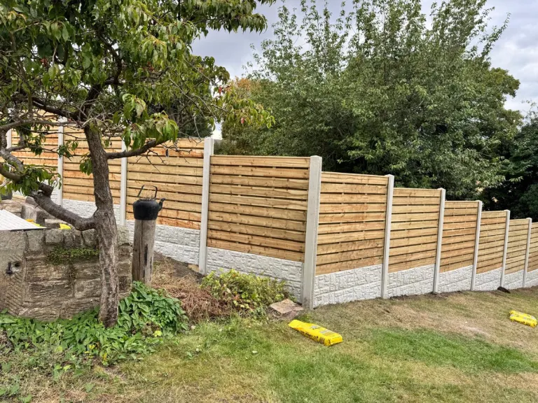 Horizontal Slatted Fencing for a Large Sloping Garden by Sheffield Fencing (photo 2)