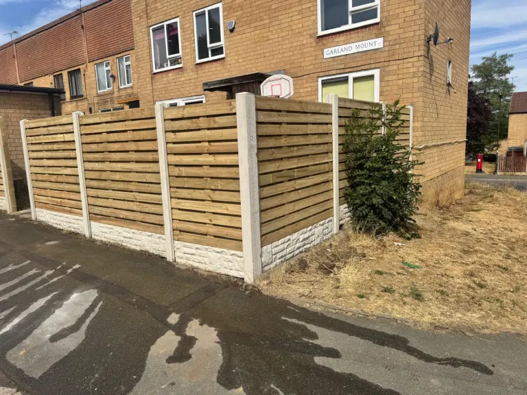 Horizontal Slatted Fencing for a Large Sloping Garden by Sheffield Fencing (photo 5)