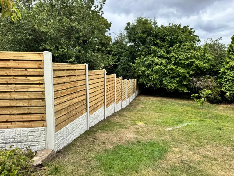 Horizontal Slatted Fencing for a Large Sloping Garden by Sheffield Fencing (photo 7)